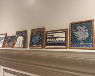 Various framed art pieces 