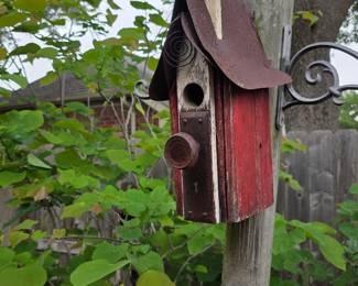 large birdhouse on pole