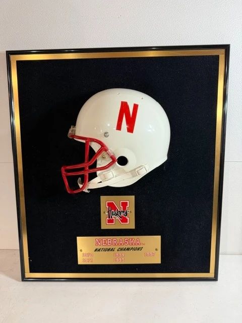 Framed Husker helmet, National Champions plaques.