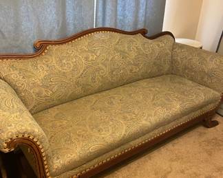 Recently upholstered Victorian sofa/lounge. Green paisley fabric