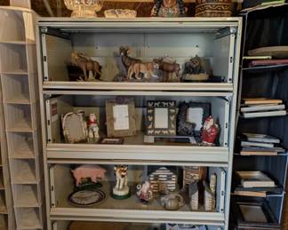 Metal cabinet filled with statues
