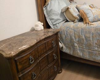 matching dresser with a beautifully curved "bombe" front and sides with serpentine drawer faces topped with a premium top of high-polished Brown Emperador Marble.