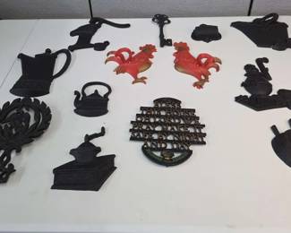 Collection Of Vintage Cast Iron And Metal Wall Decor And Hot Dish Holders