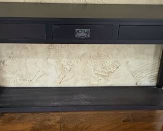 Black Console Table with Three Drawers and Ornate Pulls