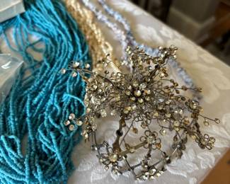 the object on the right holds a hair bun.  It opens and closes to fit any size bun!  we have earrings to match. 