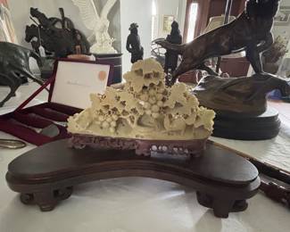 Carved oriental jade on stand