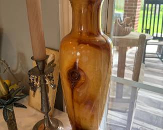 This tall vase is carved of wood. gorgeous