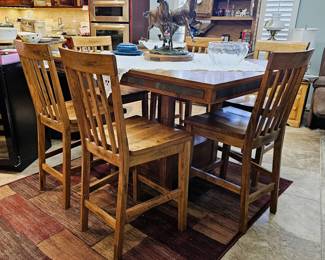 Wood dining table with extending leaf