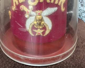 vintage Shriners fez, a collectible accessory worn by members of the Ancient Arabic Order of the Nobles of the Mystic Shrine. It is decorated with gold bullion embroidery that reads "AL BAHR", along with a pharaoh's head emblem, a crescent moon, and a sword, all set upon a maroon velvet fabric.