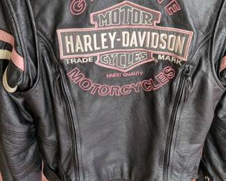 Women's Harley-Davidson "Genuine Motor Cycles" Leather Jacket (likely part of or related to the Pink Label collection). This is a sought-after style for estate sales because the pink embroidery appeals to a specific niche of female riders. So you best be first in line ladies!