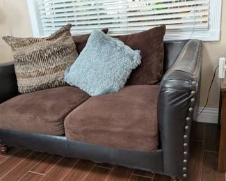 Leather and suede love seat