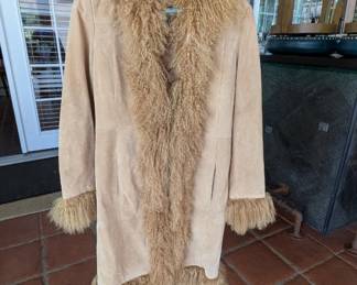 Penny Lane" coat, made famous by the 1970s aesthetic and the film Almost Famous. It’s a highly sought-after item for vintage collectors and boho-fashion enthusiasts.