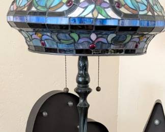 Vintage "Tiffany-Style" Stained Glass Table Lamp Intricate multi-color floral design with blue border Decorative "jeweled" cabochon accents Heavy ornate bronze-tone base Dual pull-chain sockets Excellent condition – no visible cracks
