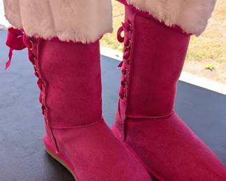 New in box:Justfab Mckenna Faux Fur Winter Boots features a bright pink suede exterior, ribbon lace-up detailing, and plush white faux fur lining. 