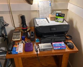 wood end table, printer, interesting lamp