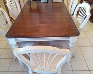 Has 6 chairs in additional leaves to make for a huge beautiful dining table.