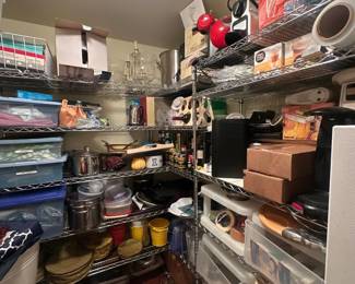 Pantry full of kitchen essentials and table linens