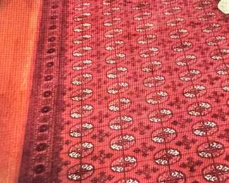 Original hand-knotted Bokhara rug.   Wool pile on cotton foundation.  Elephant foot design.  Red field & red border (age 30-50 yrs) 8’10”x11’9”