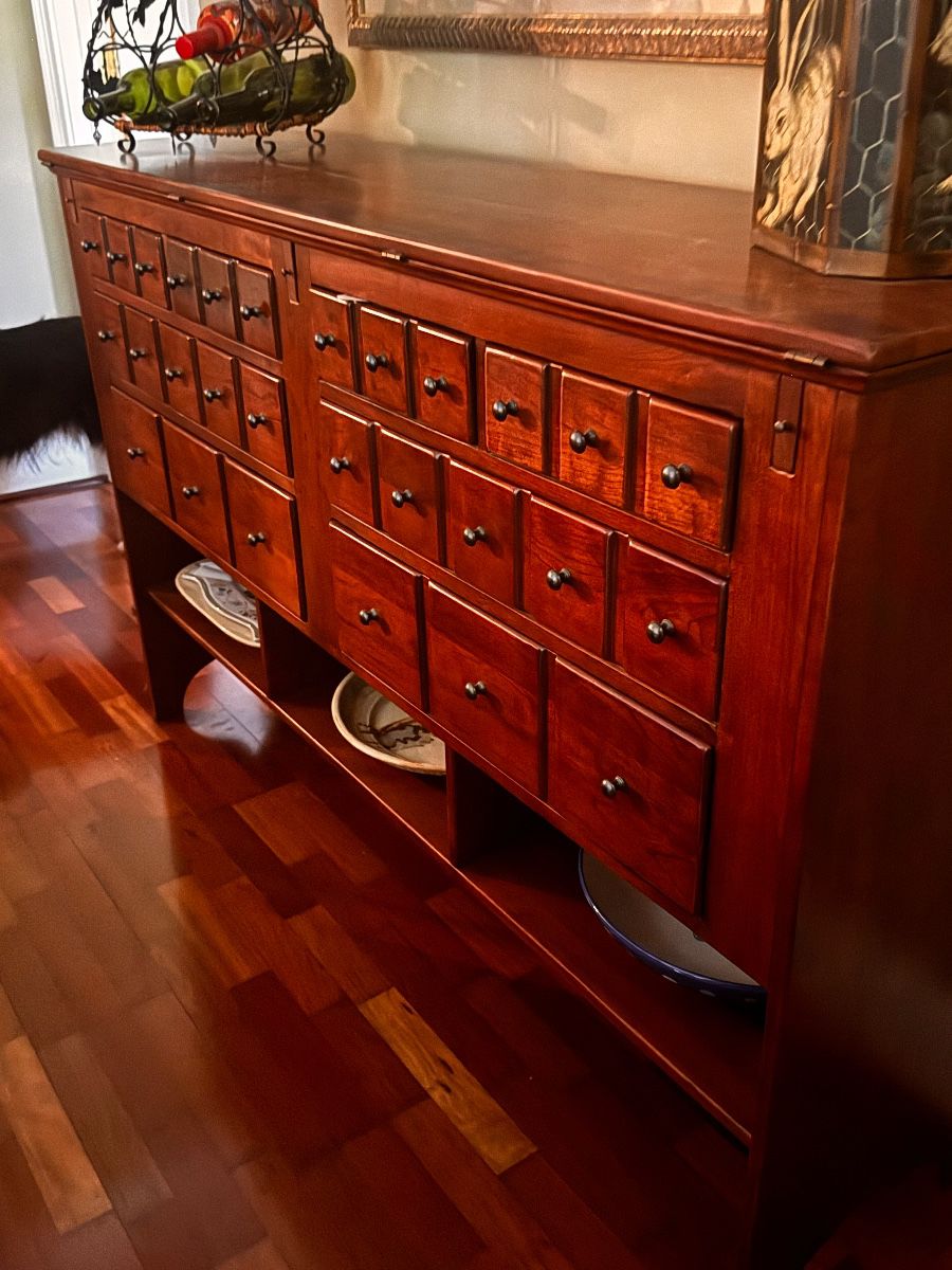 Storage: Includes eight dovetailed drawers. Organization: Often features at least one drawer lined with felt and divided for silverware. Display: Includes three open shelves at the bottom for additional storage or display. Dimensions: Approximately 62" W x 16" D x 40.5" H (depth increases to 23" when open). 