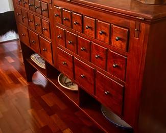 Storage: Includes eight dovetailed drawers. Organization: Often features at least one drawer lined with felt and divided for silverware. Display: Includes three open shelves at the bottom for additional storage or display. Dimensions: Approximately 62" W x 16" D x 40.5" H (depth increases to 23" when open). 