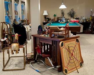 Game table, vintage toys, crokinole board and more throughout the home