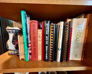 Collection of cookbooks and recipe binders.