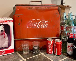 Original vintage Coca-Cola cooler with bottles, glasses and advertising collectibles