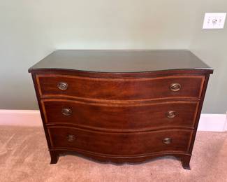 Wood dresser with curved front and three drawers. Includes glass top protector
