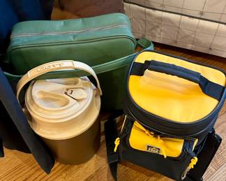 Vintage cooler lot including Gott insulated beverage cooler with spout, retro green soft-sided cooler, and Igloo lunch cooler. 