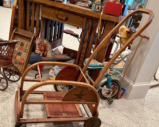 Vintage child’s stroller, tricycle, wooden toys and antique children’s items