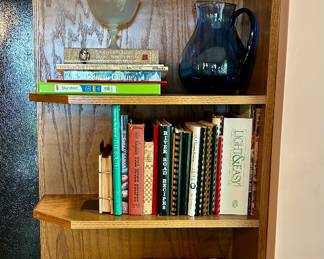 Collection of cookbooks and recipe binders.