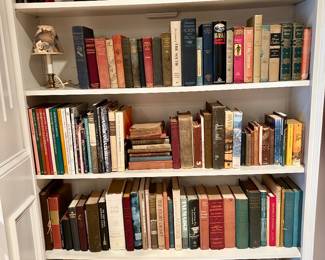Assorted books including vintage and hardcover titles.