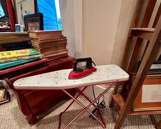 Vintage tabletop ironing board with electric iron