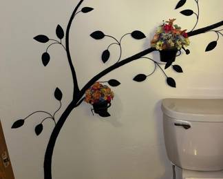 Left side of metal tree with flower pots