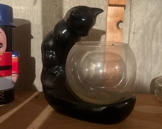 Black cat, looking in fishbowl