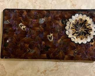 Feather and leather checkbook cover