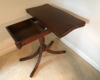mahogany game table with topslid open to show storage
