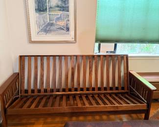 This gorgeous futon, solid wood can be yours. We have the original mattress that goes on it and we also have a mattress at the Client purchased for a little bit more comfort.    In other words for long staying guests 