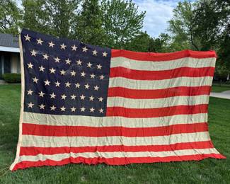 This is a 45 star antique flag with bunting. In good condition given the age but does have some dry rot. I do not have the measurements yet - 3 people holding up