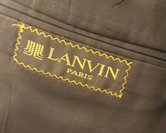 Lanvin Paris black wool tuxedo set with satin peak lapels, matching trousers, and cummerbund — classic formalwear in excellent vintage condition.