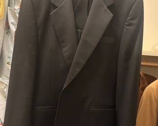 Lanvin Paris black wool tuxedo set with satin peak lapels, matching trousers, and cummerbund — classic formalwear in excellent vintage condition.