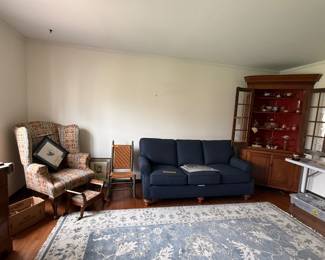 Gorgeous wingback chairs, assorted furniture, and display cabinets 