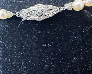 14k white gold clasp, with a sapphire 