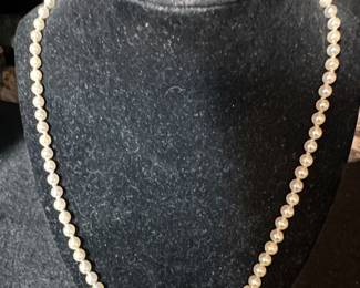 22” Graduated , 4mm to 8mm Pearl Necklace. 14 k white gold clasp with a sapphire 