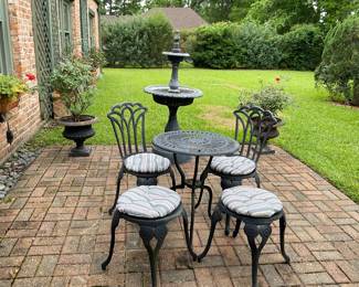 Two planters with rose bushes have sold. Table and chairs have sold. 