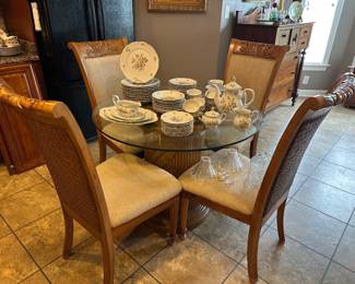 Round glass top breakfast table with four chairs