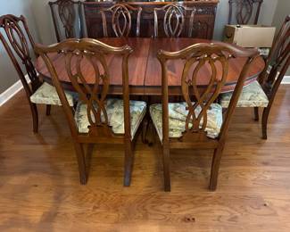 Antique mahogany 52” round with 4 - 11.5” extensions, has split pedestal base with claw feet 