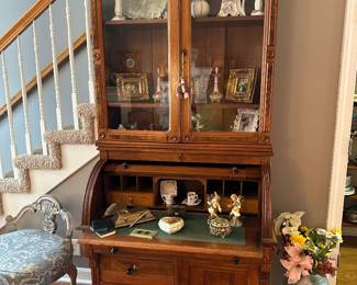 Antique walnut barrel lid secretary with bookcase/display top