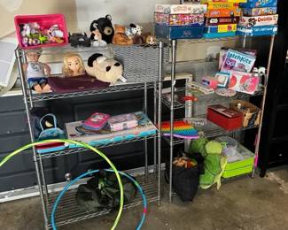 Shelves Of Toys & Games Includes classic family games like Sorry, Pictionary,  Trouble, and Twister. 