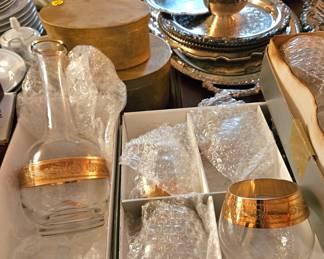 Beautiful crystal decanter with wide gold band. Have wine, champagne and brandy glasses to match